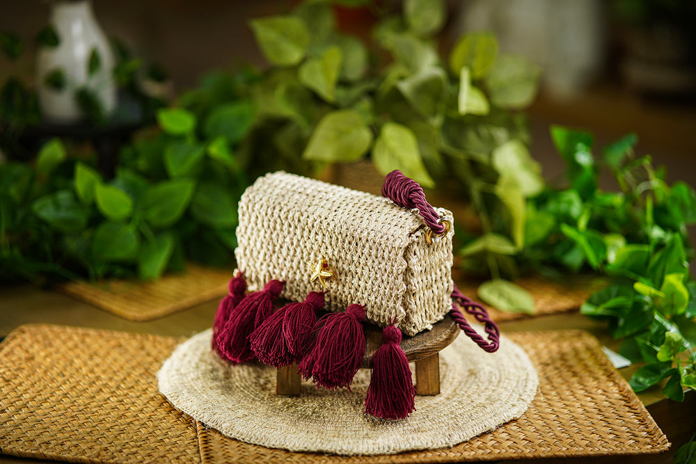 Woven Bag with Burgundy Tassels and Golden Star Detail