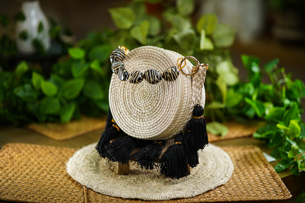 Round Woven Bag with Black Tassels and Printed Bead Handle